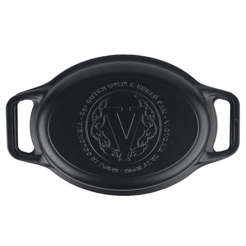 Tapa de olla ovalada Victoria con emblema central en relieve, vista superior